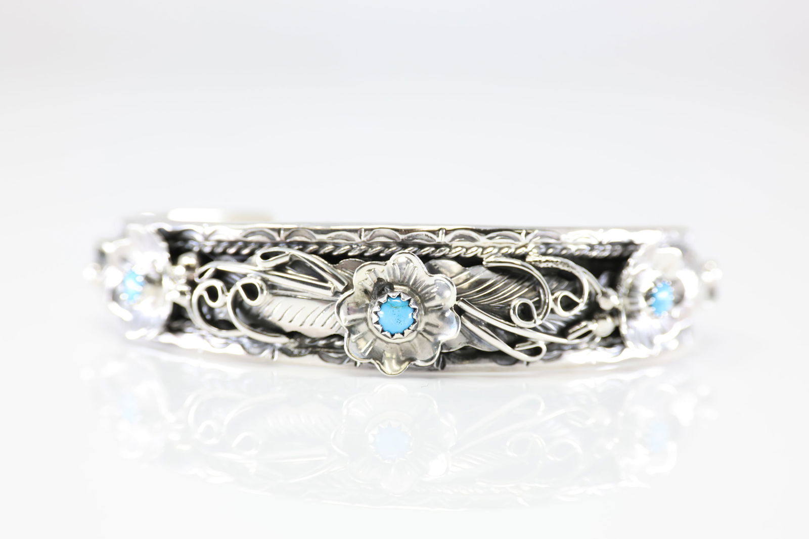 Native American Sterling Silver Turquoise Bracelet Floral By Bessie Joe.: This is a Native American Sterling Silver Turquoise Bracelet Floral By Bessie Joe.