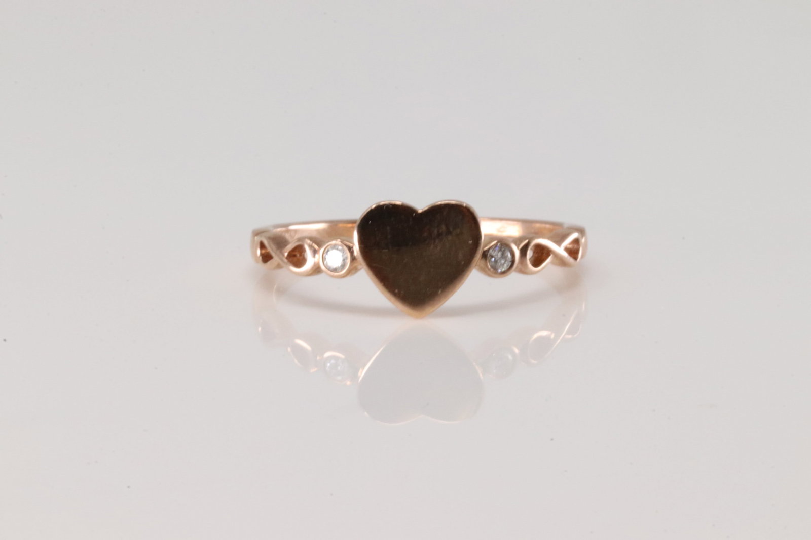 Diamond Heart Ring 10Kt.: 10Kt Rose Gold Diamond Heart Ring. This Charming Ring has Heart Design with 2 Sparkling Diamonds. Ring size: 9.00. Total weight: