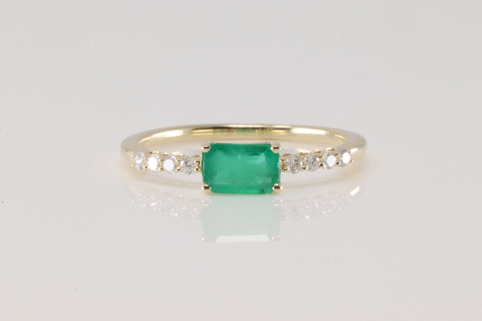 Emerald & Diamond Ring 14Kt.: Ladies 14Kt Yellow Gold Emerald & Diamond Ring. This Ring has Green Emerald with 8 Sparkling Diamonds. Diamonds weight: 0.12ctw. Emerald weight: 0.40ct. Ring size: 6.50.