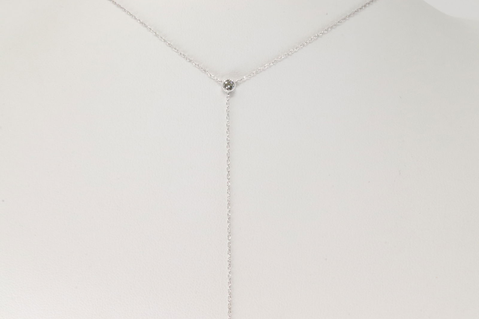 Diamond Dangle Necklace 14Kt.: Ladies 14Kt White Gold Diamond Dangle Necklace. This Elegant Necklace has 2 Sparkling Diamonds. Diamonds weight: 0.11ctw. Necklace length: 18.00"
