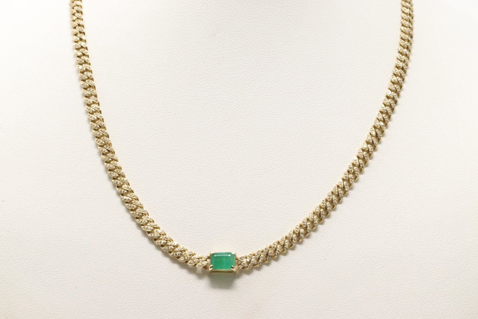 Emerald & Diamond Cuban Link Necklace 14Kt.: 14Kt Yellow Gold Emerald & Diamond Cuban Link Necklace. This Cuban Design Necklace has Cut Green Emerald with 726 Sparkling Accent Diamonds. Diamonds weight: 1.45ctw. Emerald weight: 1.17ct. Necklace