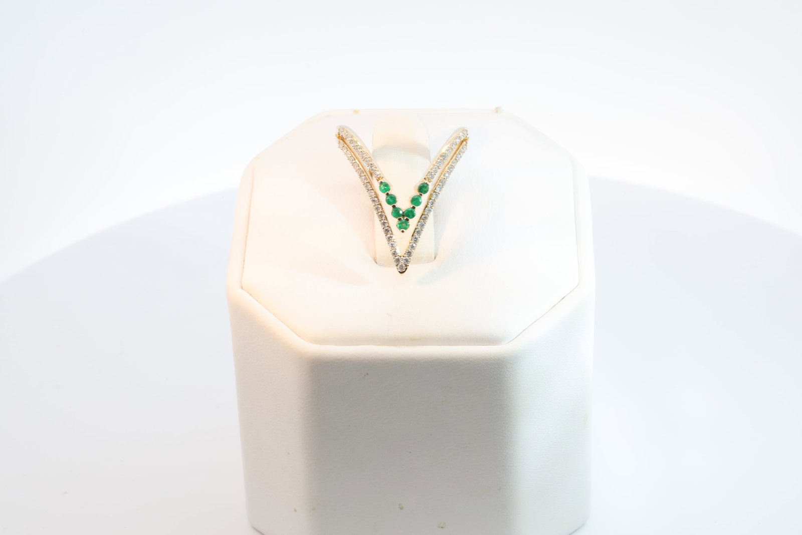 Emerald & Diamond Ring 14Kt.: Ladies 14Kt Yellow Gold Emerald & Diamond Ring. Ring has V Design with 7 Emerald with & 55 round Diamonds. Diamonds weight: 0.33ct. Emerald's weight: 0.13ct. Ring size: 7.00. Total weight: 3.30 Grams.