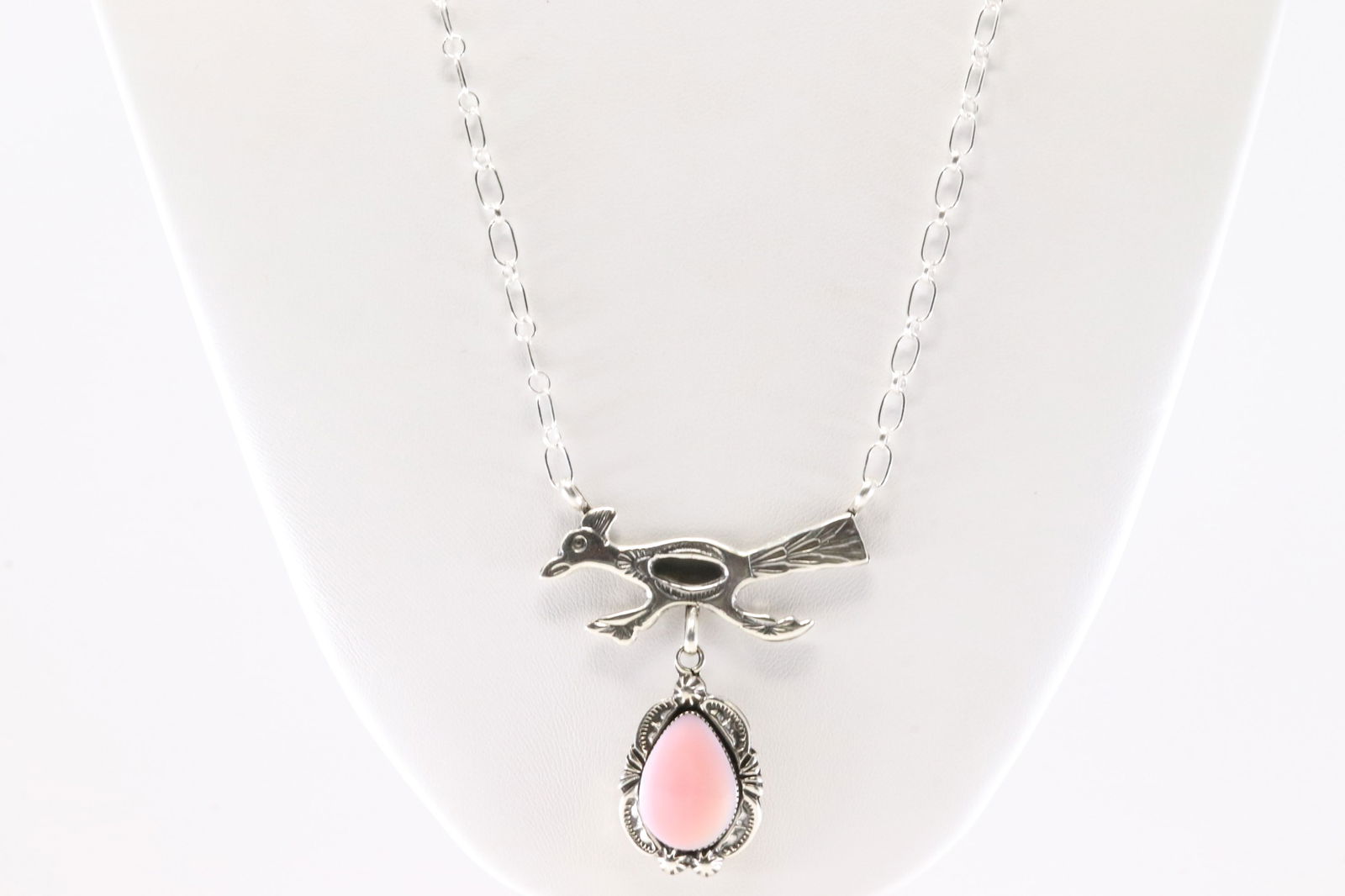 Native American Navajo Sterling Silver Pink Conch Road Runner Necklace By Michael Yazzie. From R.B: This is a Native American Navajo Sterling Silver Pink Conch Road Runner Necklace By Michael Yazzie. From R.B Company. Stamp R.B. Necklace Length: 20.00.