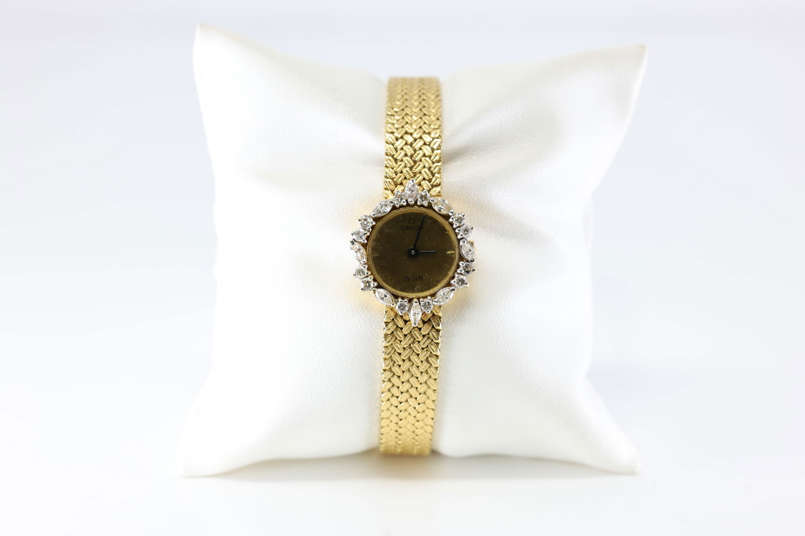 Omega Diamond Watch Women 18Kt.: Ladies 18Kt Yellow Gold Omega Diamond Watch. Gorgeous Watch has Marquis Brilliant Diamonds With Classic Design. Diamond Weight Approx: 0.60 ctw Watch Length: 15.00. Total Weight: 36.70 Grams.