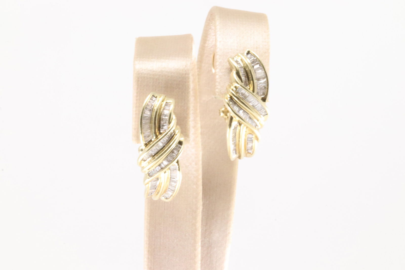 Diamond French Clip Earring: Ladies 10Kt Yellow Gold Diamond French Clip Earring. This beautiful hoop earring's has french clip with an total of 104 baguette diamonds. Diamonds weight approx: 2.00cttw. Total weight: 6.30 Grams.