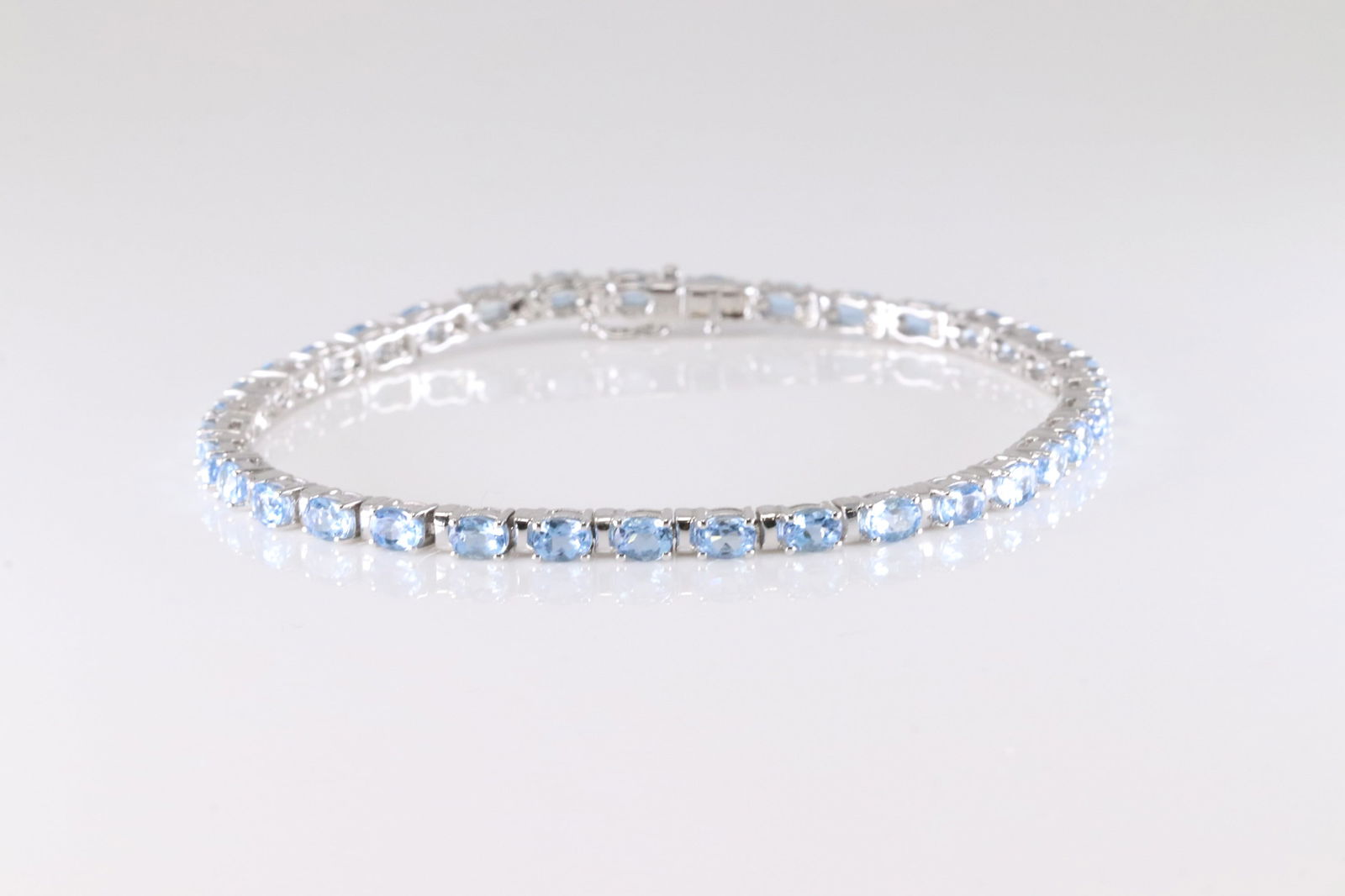 Aquamarine Bracelet 14kt.: Ladies 14kt White Gold Blue Aquamarine Gemstone. This Elegant Bracelet Has 35 Blue Aquamarine Gemstone Around. Bracelet Length: 16.00". Total Weight: 11.10 Grams.