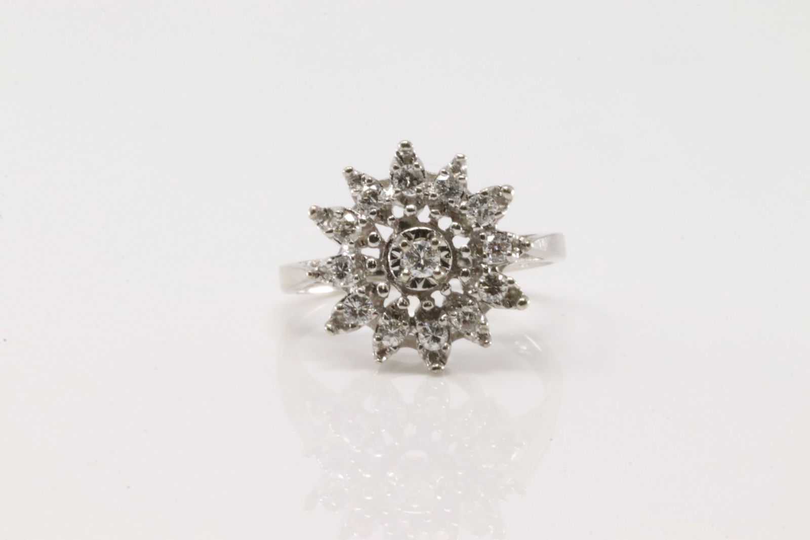 Elegant Diamond Ring 14Kt.: Ladies 14Kt White Gold Diamond Ring. This elegant ring has 13 brilliants round diamonds. Diamonds weight approx: 0.30 ctw Ring size: 6.00. Total weight: 3.90 Grams.