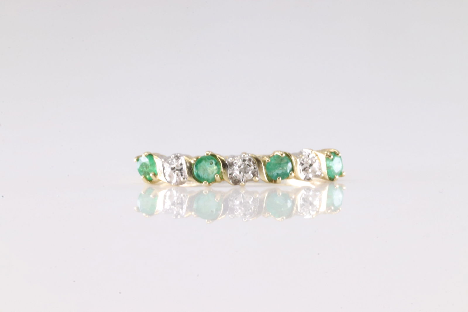 Emerald & Diamond Ring 10Kt.: Ladies 10Kt Yellow Gold Emerald & Diamond Ring. This Ring has 4 Beautiful Emerald Gemstones With 4 Round Sparkling: Ring Size: 6.50.