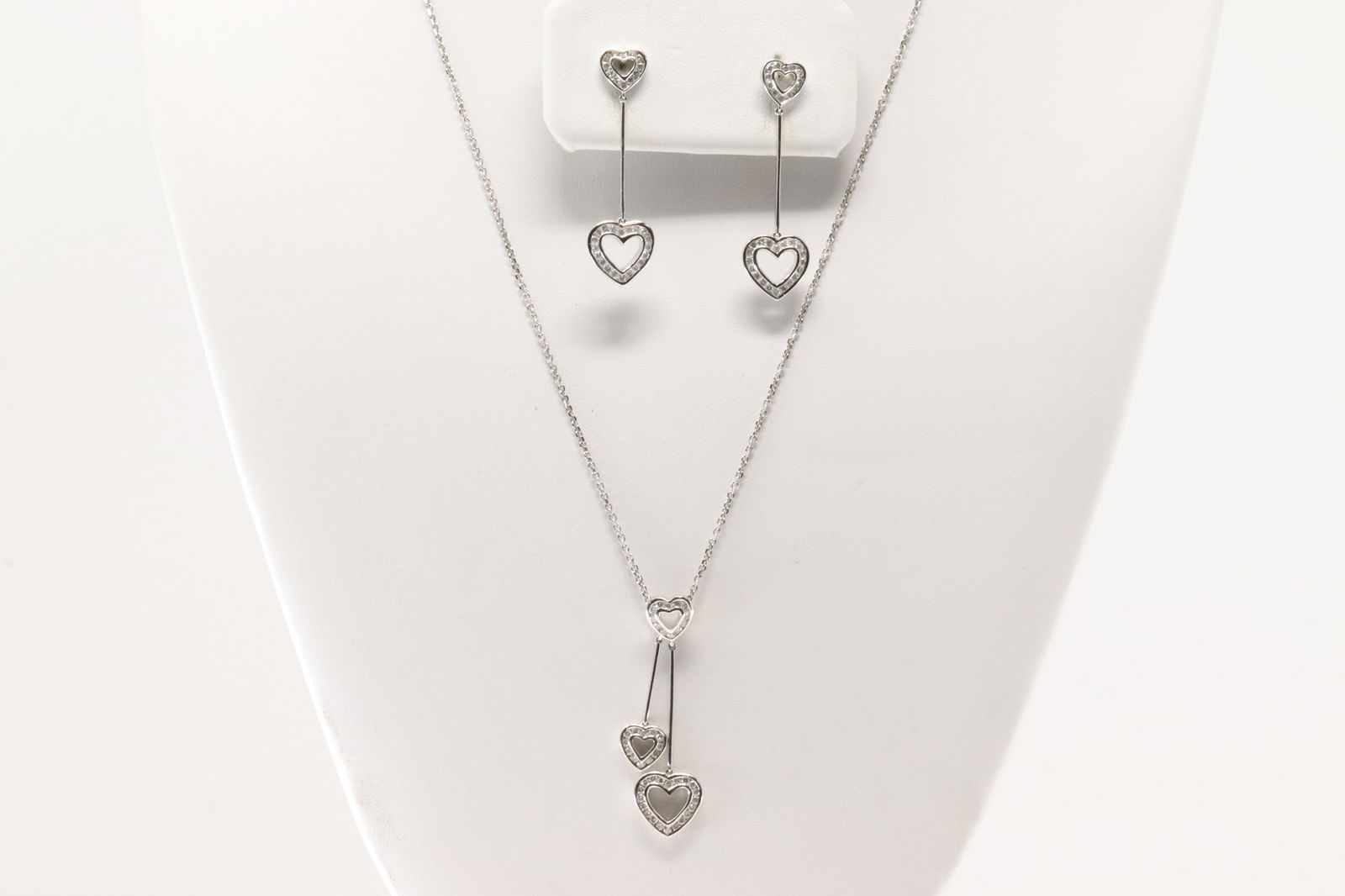 Diamond Heart Dangling / Stud Earring & Necklace Set 18Kt.: Ladies 18Kt White Gold Diamond Heart Dangling / Stud Earring & Necklace Set. This elegant Set has Dangling / Stud Earring's with Heart Charm And White Necklace. With total of: 108 Round Brilliants