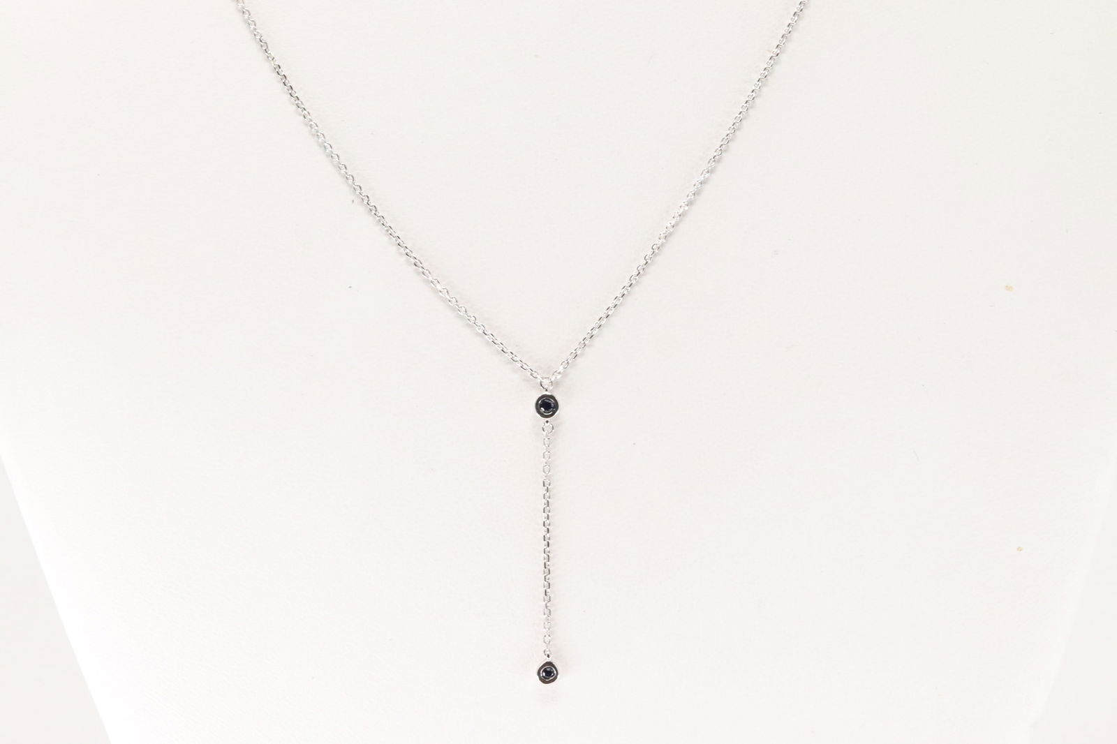 Sapphire Neckalce 14kt.: Ladies 14kt White Gold Sapphire Necklace. Neccklace With 2 Blue Sapphire Gems, Adjustable. Sapphire Weight: 0.07ct. Necklace Length: 18.00".