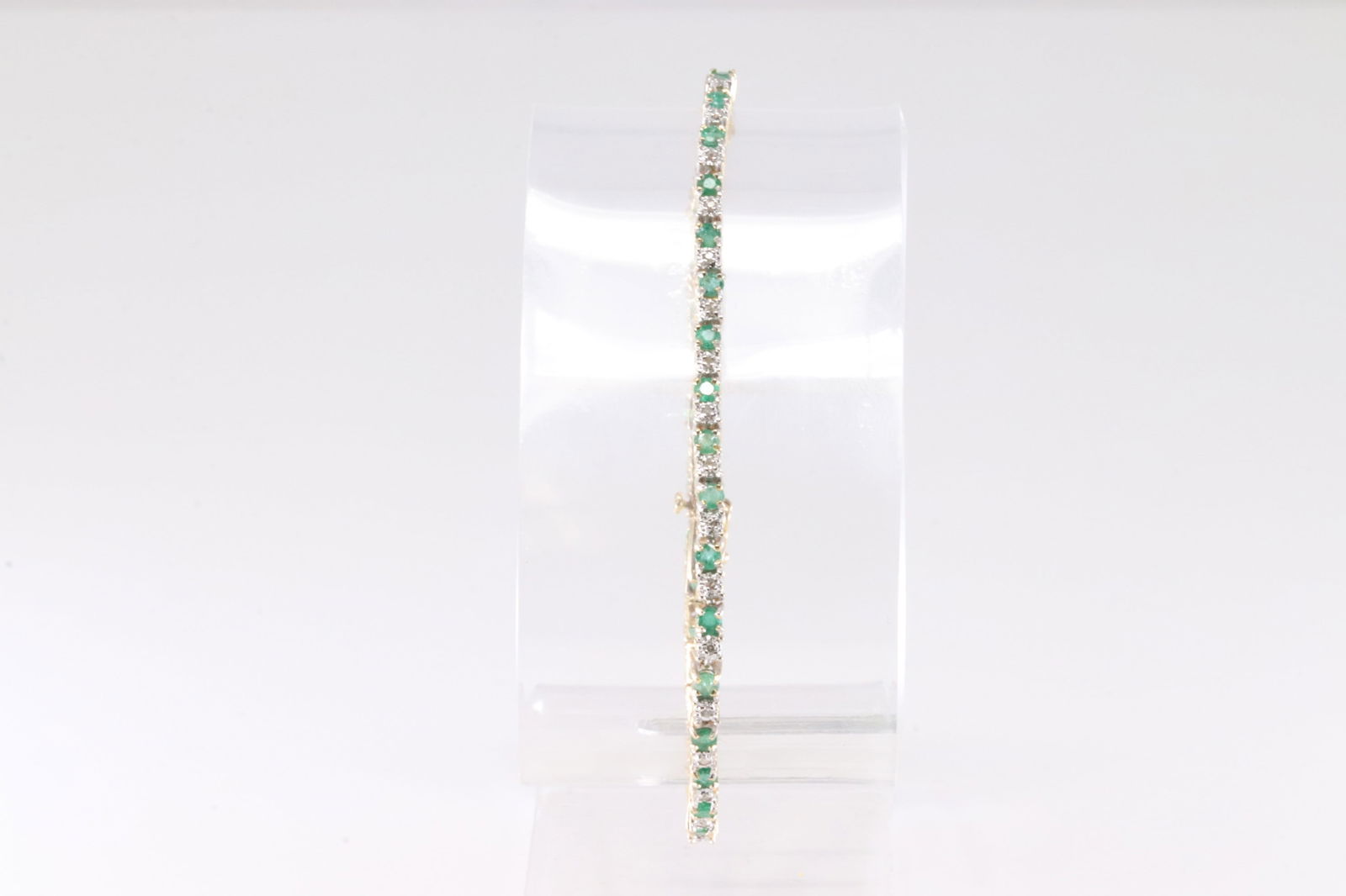 Emerald & Diamond Bracelet 14Kt.: Ladies 14Kt Yellow Gold Emerald & Diamond Bracelet. This Bracelet has 34 Emerald Gemstones With 34 Round Sparkling Diamonds. Diamond Weight Approx: 0.35 ctw Bracelet Length: 15.00. Total Weight: 8.76