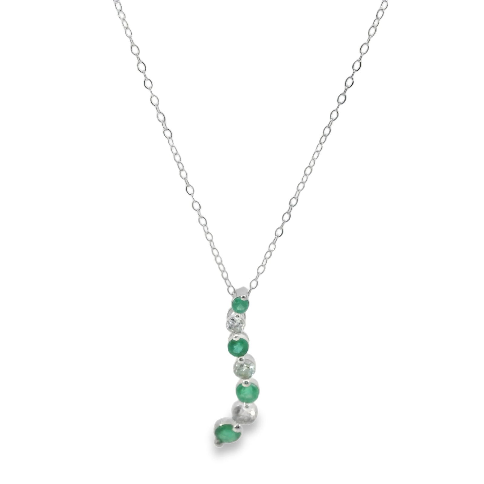 Emerald & Diamond Pendant / Necklace 14Kt.: Ladies 14Kt White Gold Emerald & Diamond Pendant / Necklace. Pendant features a delicate chain adorned with a series of Green Emerald's with 3 Brilliants Diamonds. The minimalist design ensures it
