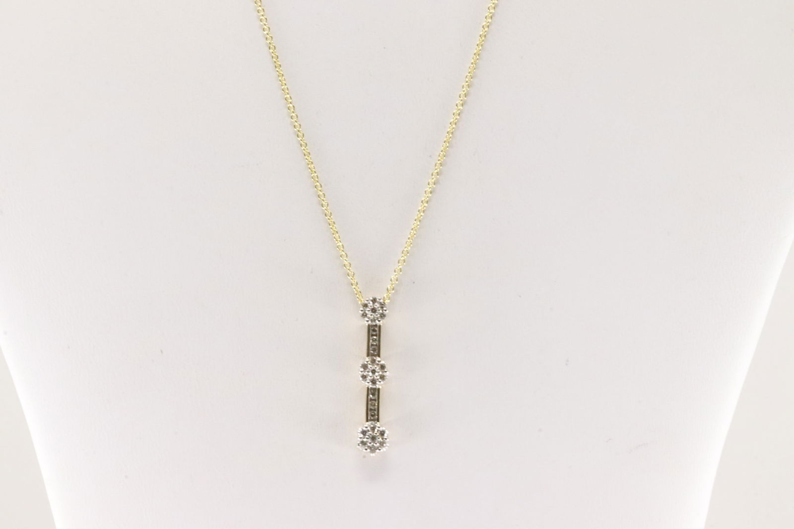 Diamond Pendant / Necklace 10Kt.: 10Kt Yellow Gold Diamond Pendant / Necklace 10Kt. This pendant has 3 flower design with 27 round diamonds and a 14K necklace. Diamonds weight approx: 0.75ctw. Necklace length: 18.00" Total weight: