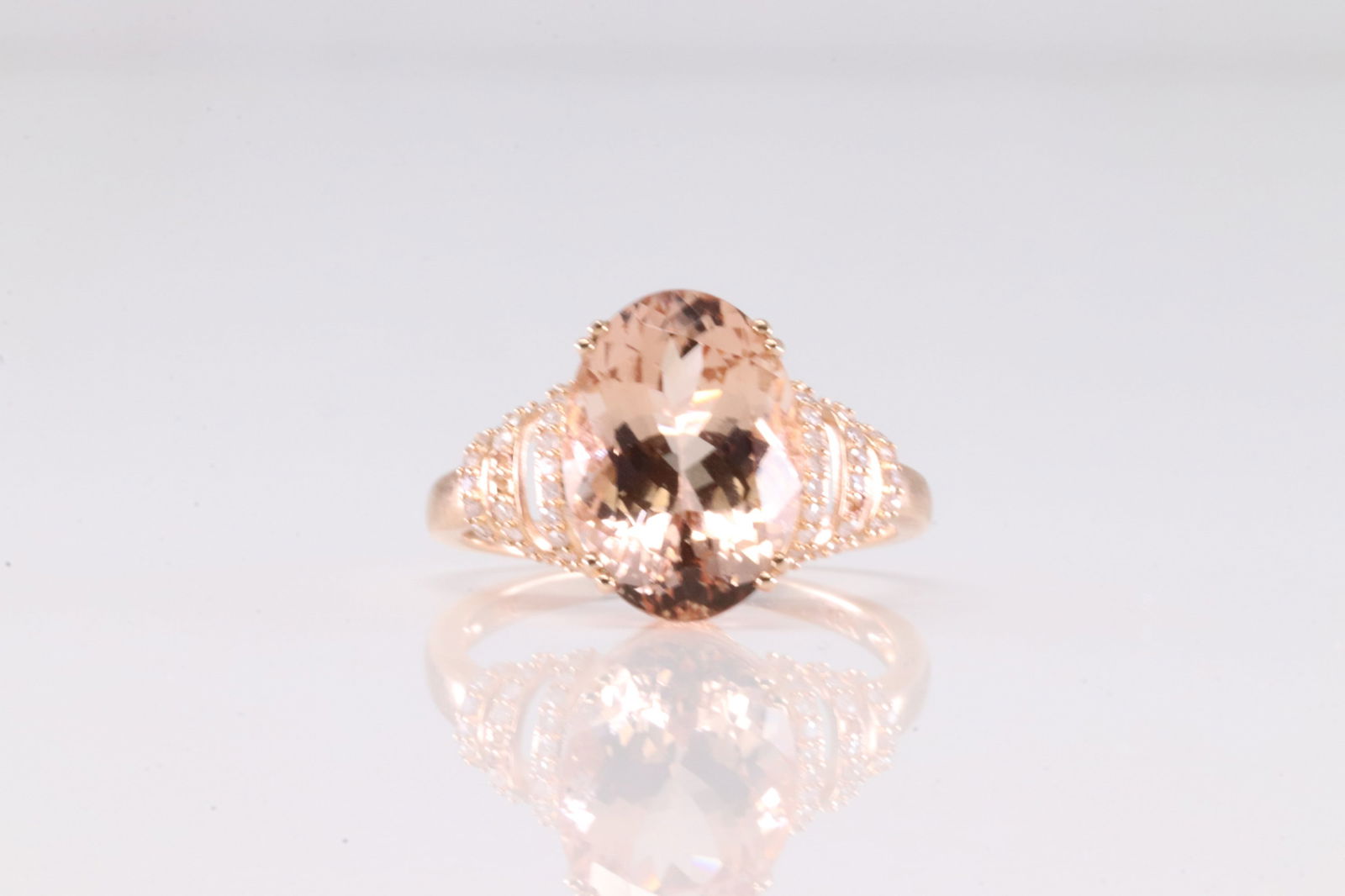 Morganite & Diamond Ring 10Kt.: Ladies 10Kt Rose Gold Morganite & Diamond Ring. This Ring has Oval Morganite Gemstone With 57 Round Sparkling Diamonds. Ring Size: 9.00. Total Weight: 3.91 Grams.