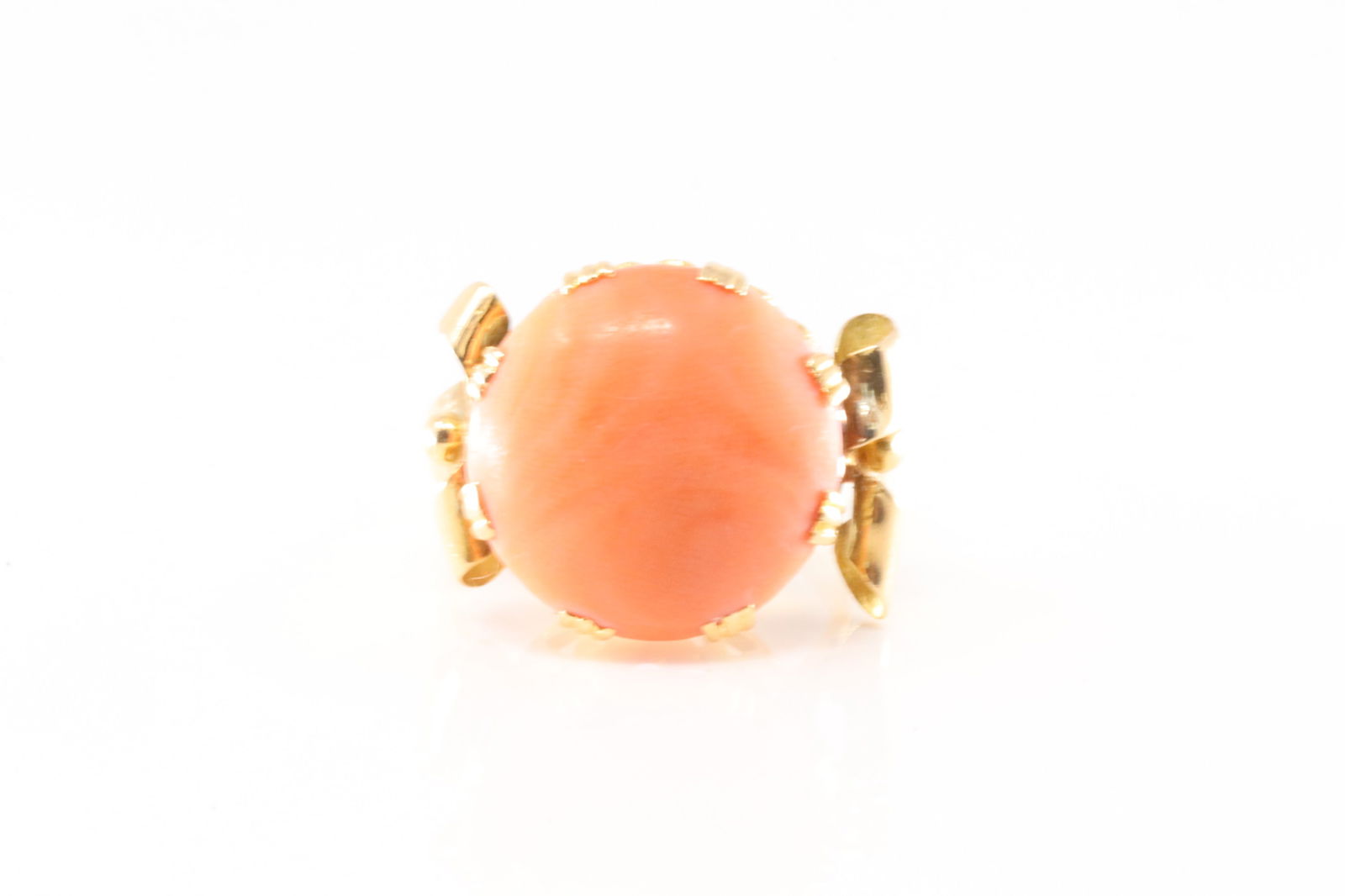 Vintage Coral Ring 18Kt.: Vintage 18Kt Yellow Gold Coral Ring. This ring has a beautiful design with orange round Coral stone. Ring size: 7.00. Total weight: 8.80 Grams.