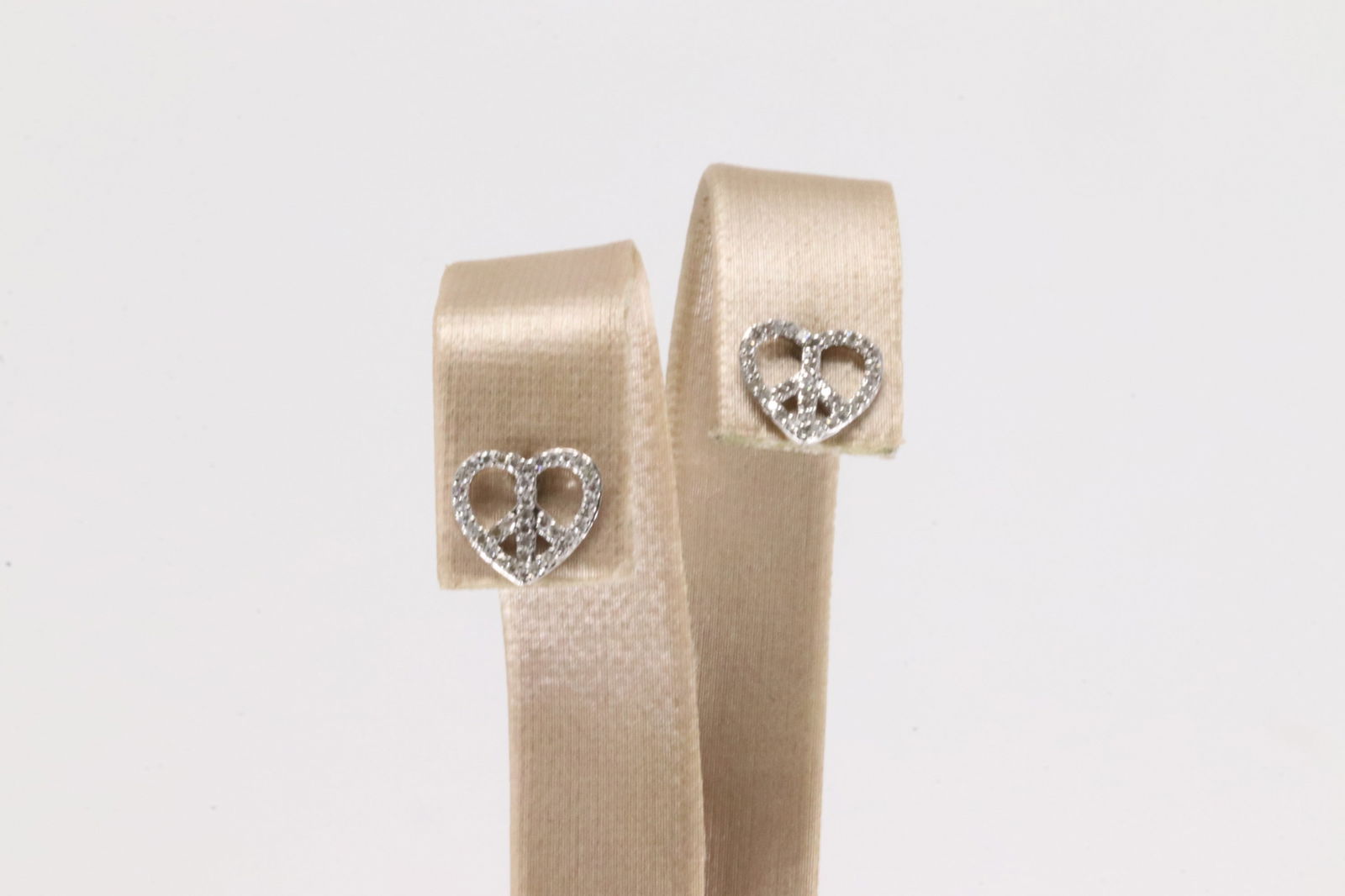 Heart Stud Diamond Earring 10Kt.: Ladies 10Kt White Gold Heart Stud Diamond Earring. This Charming Heart Stud Earring's has Sparkling round Diamonds.