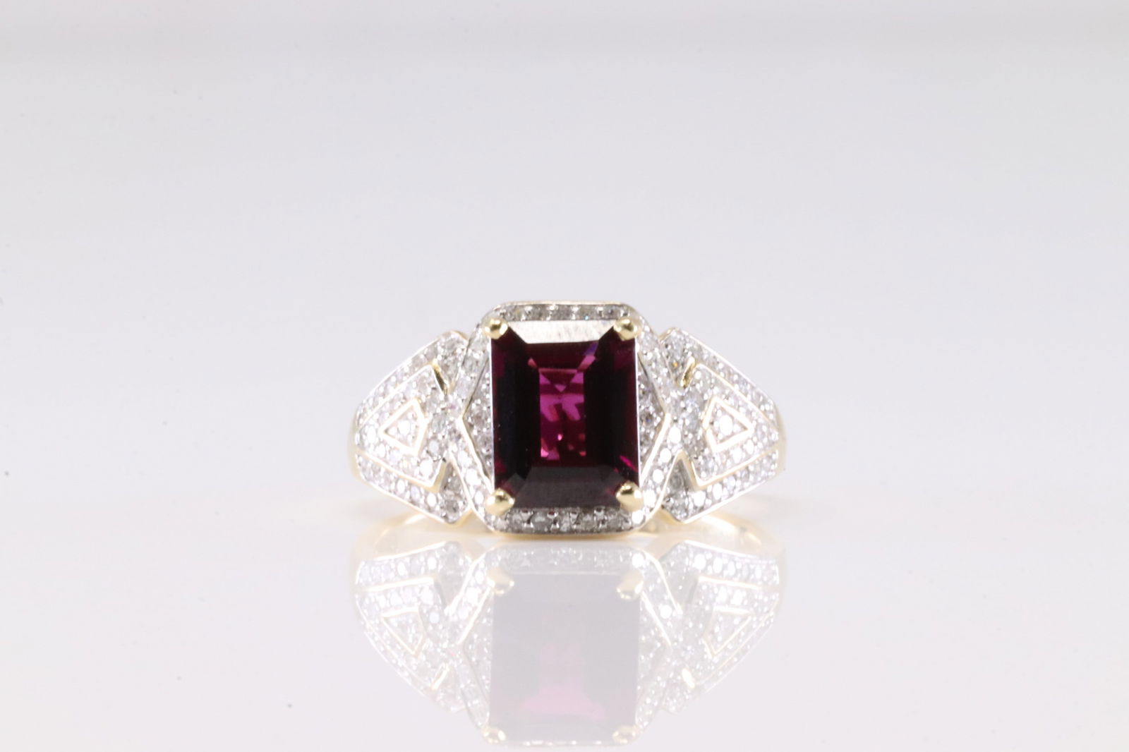 Garnet & Diamond Ring 14Kt.: Ladies 14Kt Yellow Gold Garnet & Diamond Ring. This Ring has Squared Garnet Gemstone With 98 Round Sparkling Diamonds. Diamond Weight Approx: 1.00 ctw Ring Size: 9.00. Total Weight: 5.20 Grams.
