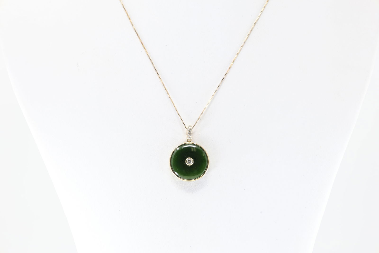 Jade & Diamond Pendant / Necklace 14Kt.: 14Kt Yellow Gold Jade & Diamond Pendant / Necklace. Pendant has Jade stone with one round brilliant diamond in the center / 15 more up on bell with a 14K Necklace. Diamonds weight approx: