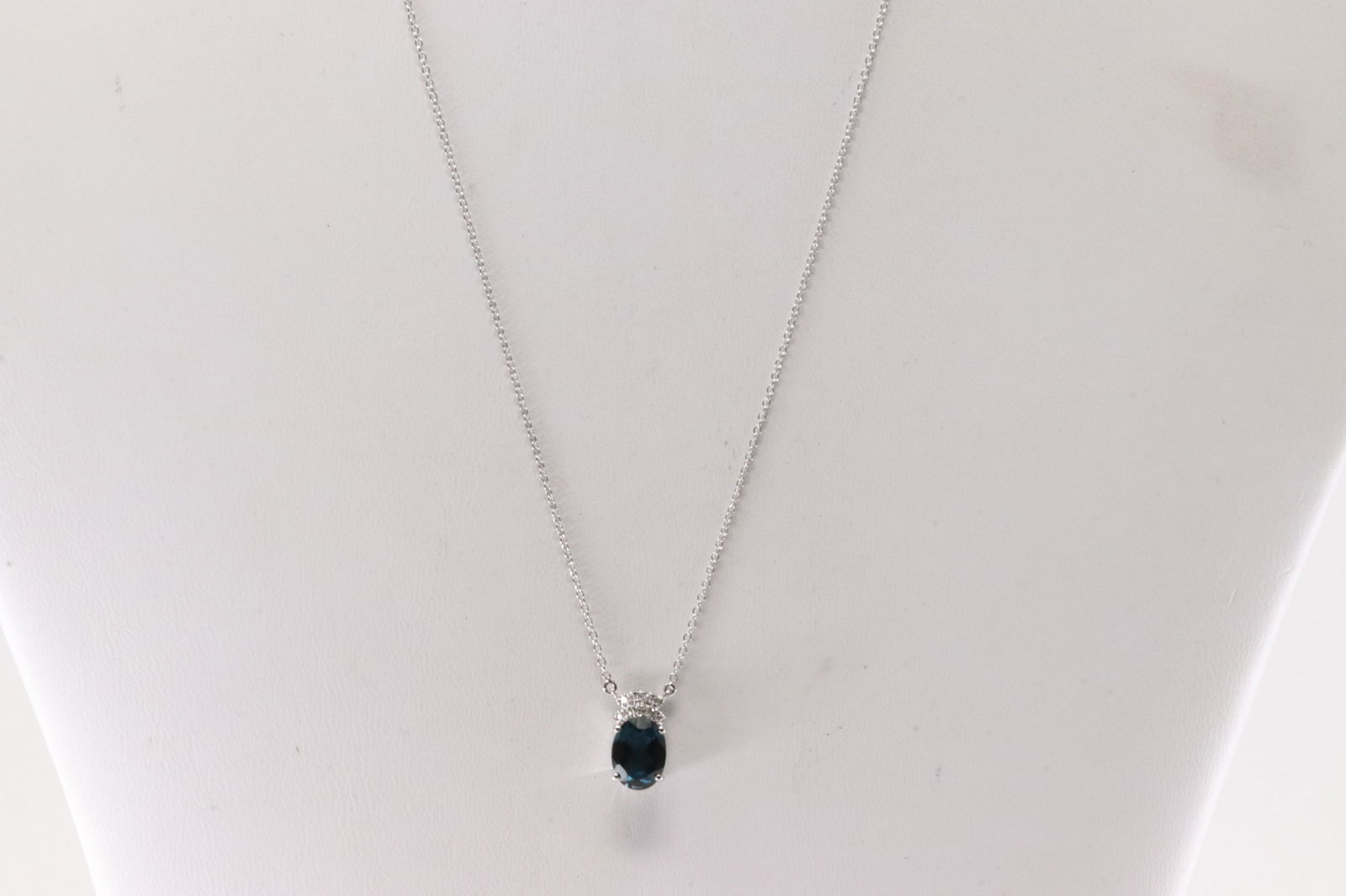 London Blue Topaz & Diamond Pendant / Necklace 10Kt.: Ladies 10Kt White Gold London Blue Topaz & Diamond Pendant / Necklace. This Necklace has Charming Pendant with London Blue Topaz with round Diamonds. Diamonds weight: 0.07ctw. Necklace length: 18.00"