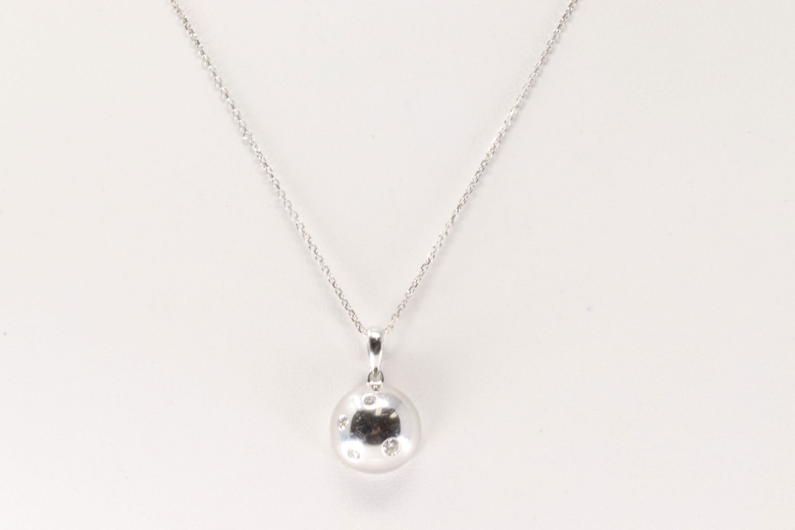 Diamond Pendant / Necklace 18Kt.: 18Kt White Gold Diamond Pendant / Necklace. This charming pendant has 4 sparkling diamonds with a 14k necklace. Necklace length: 16.00" Total weight: 4.10 Grams.