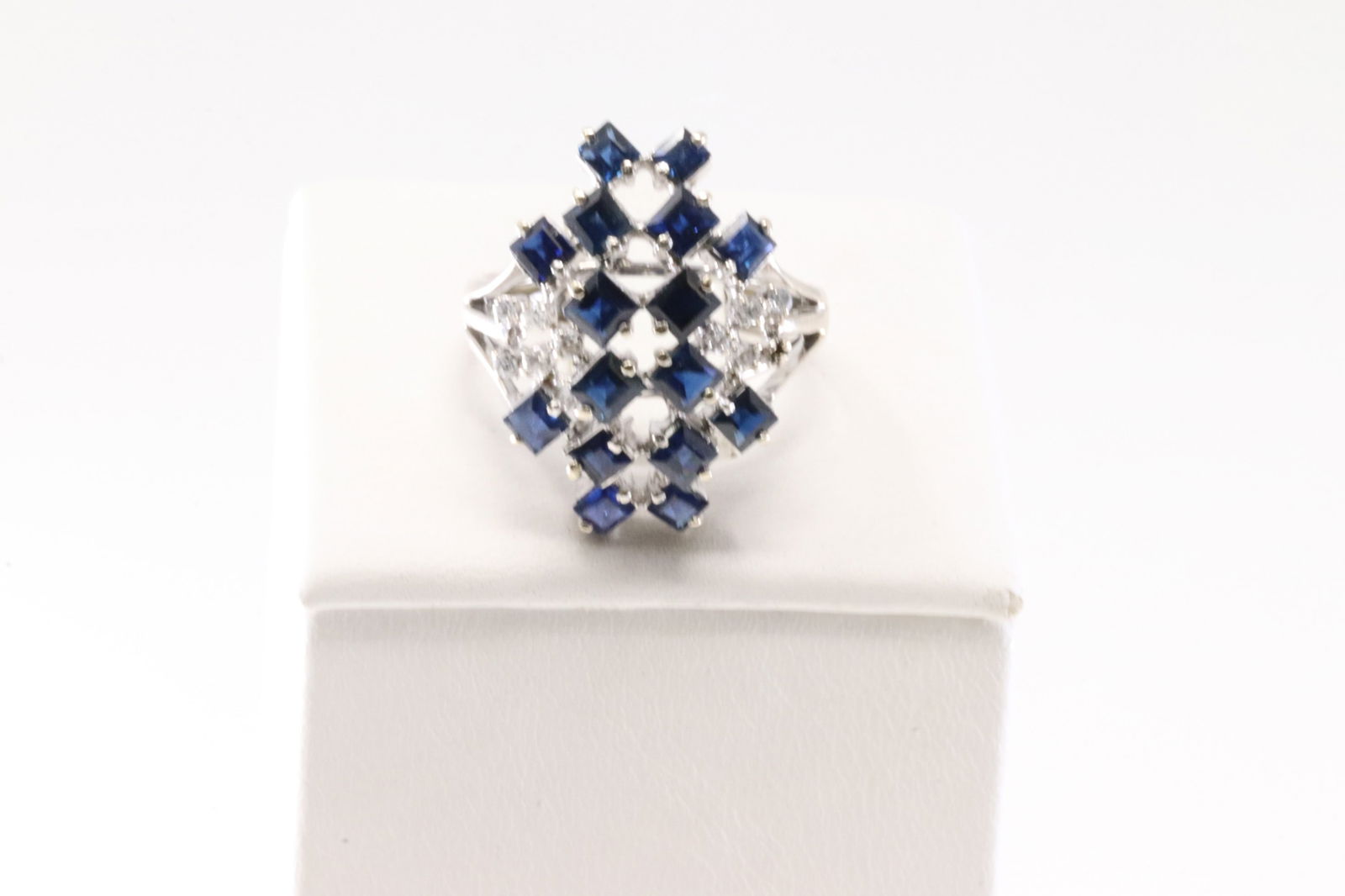 Sapphire & Diamond Ring 14Kt.: Ladies 14Kt White Gold Sapphire & Daimond Ring. This Elegant Ring has 16 Sapphire Gemstones With 9 Round Sparkling Diamonds. Diamond Weight Approx: 0.35ctw. Ring Size: 7.00. Total Weight: 5.58 Grams.