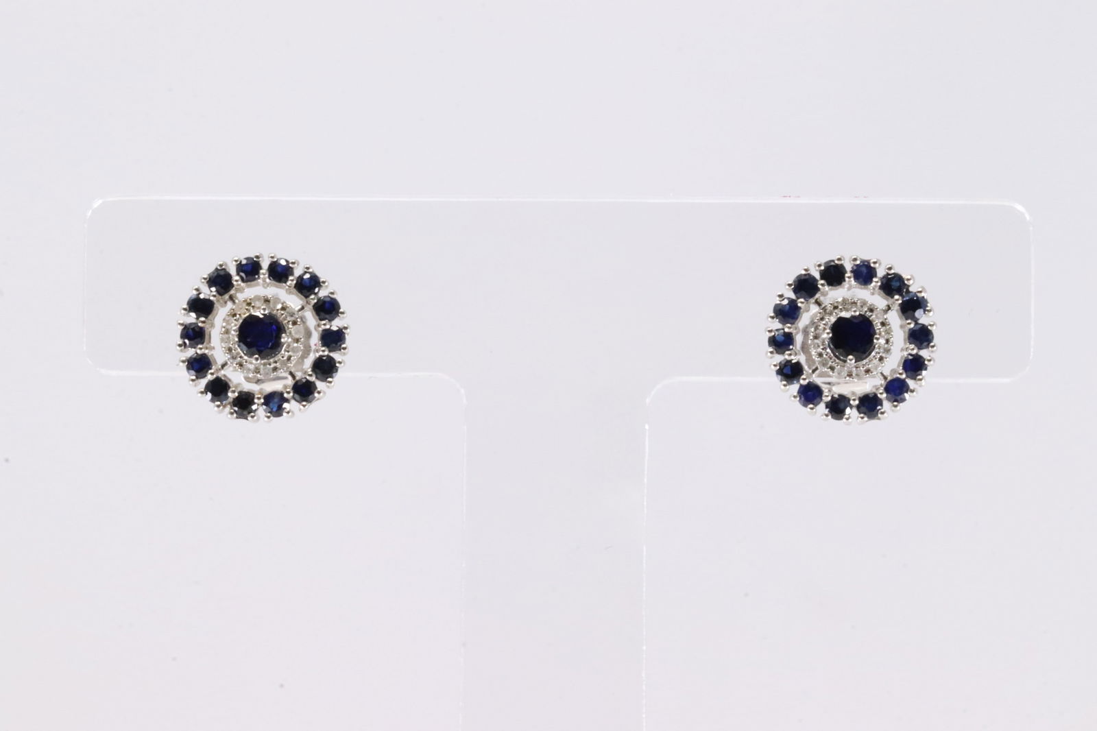 Sapphire & Diamond Stud Earring 14Kt.: Ladies 14Kt White Gold Sapphire & Diamond Stud Earring. This Charming Earring's has 30 Sapphire Gemstones With 24 Round Brilliant Diamonds.