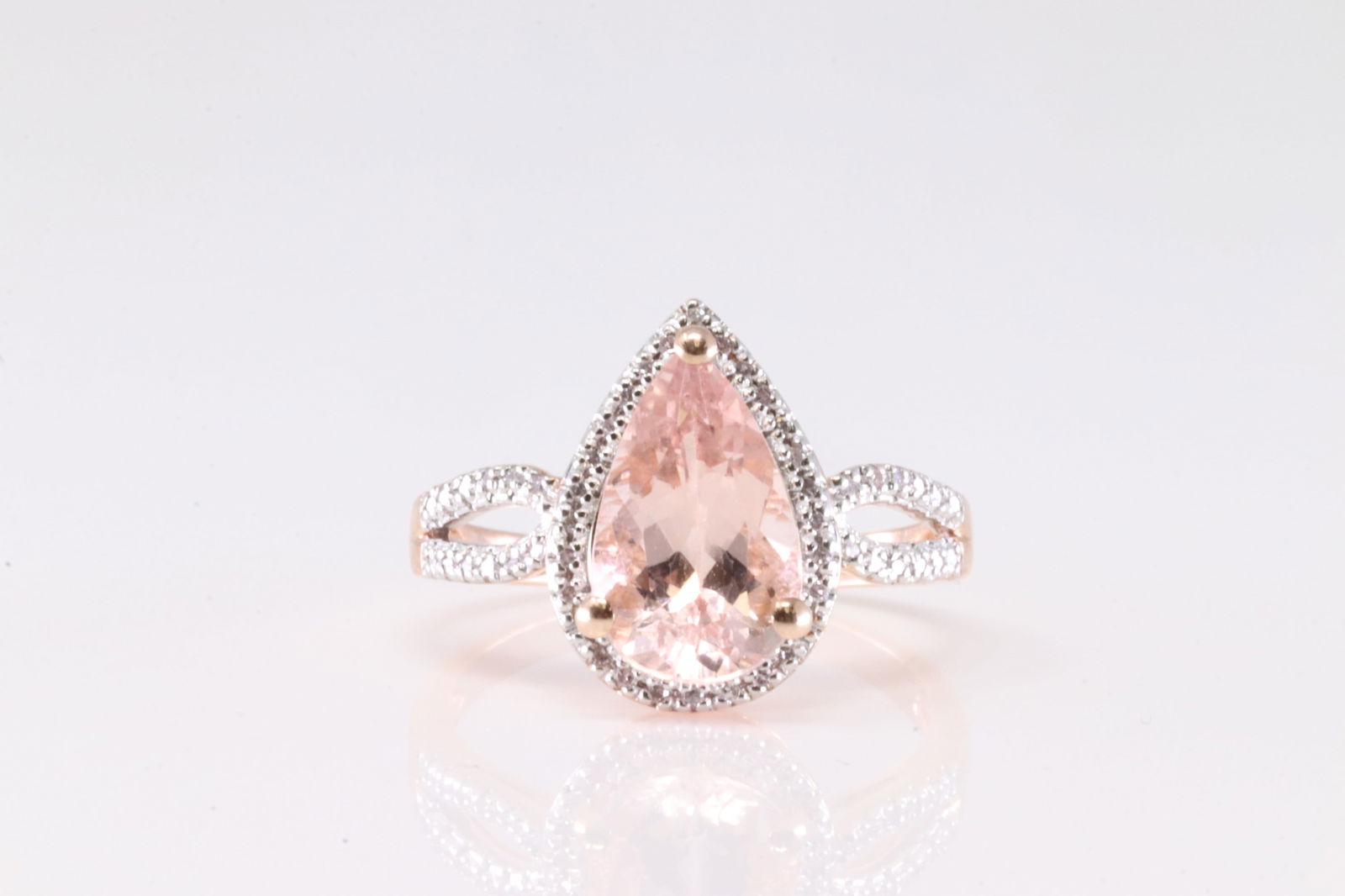 Morganite & Diamond Ring 10Kt.: Ladies 10Kt Rose Gold Morganite & Diamond Ring. This Ring has Pear Shaped Morganite Gemstone With 52 Round Sparkling Diamonds Ring Size: 9.00. Total Weight: 4.00 Grams.