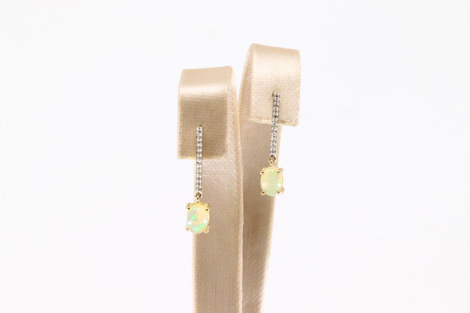 Opal & Diamond Stud / Dangling Earring 10Kt.: Ladies 10Kt Yellow Gold Opal & Diamond Stud Earring. This Charming Stud / Dangling Earring has Oval Opal with Sparkling round Diamonds. Diamonds weight: 0.15ctw.