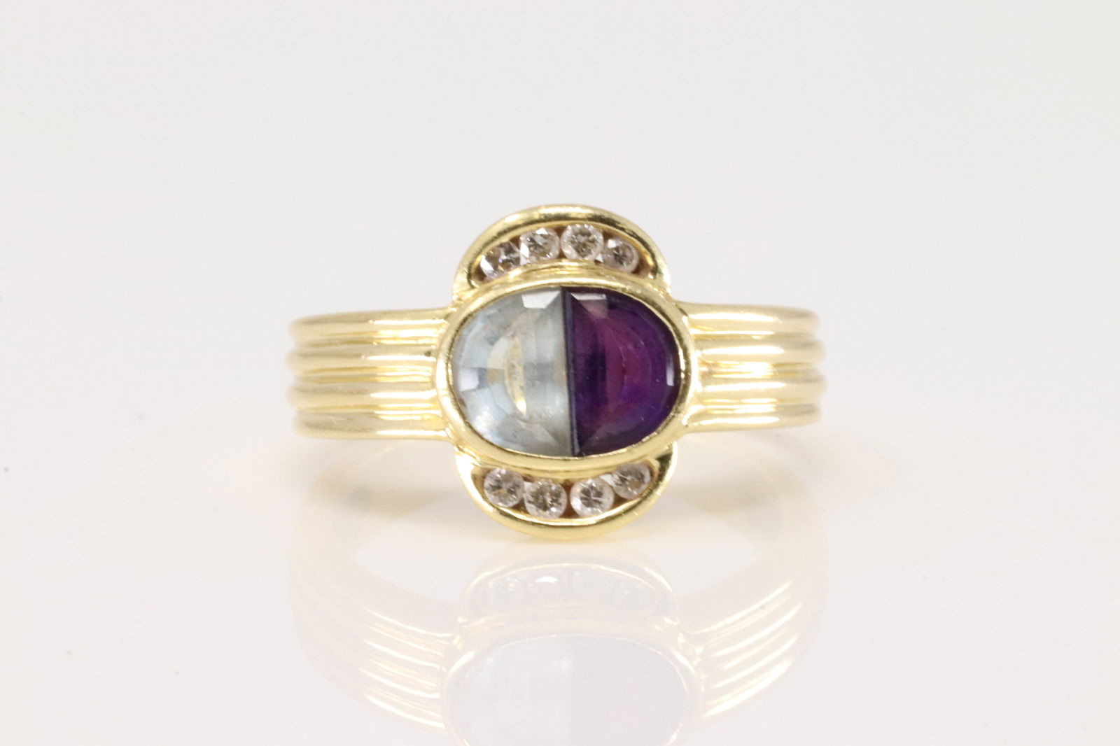 Amethyst / Aquamarine & Diamond Ring 18Kt.: Ladies 18Kt Yellow Gold Amethyst / Aquamarine & Diamond. This ring has multi-color gems with 8 round diamonds. Ring size: 5.00. total weight: 4.70 Grams.