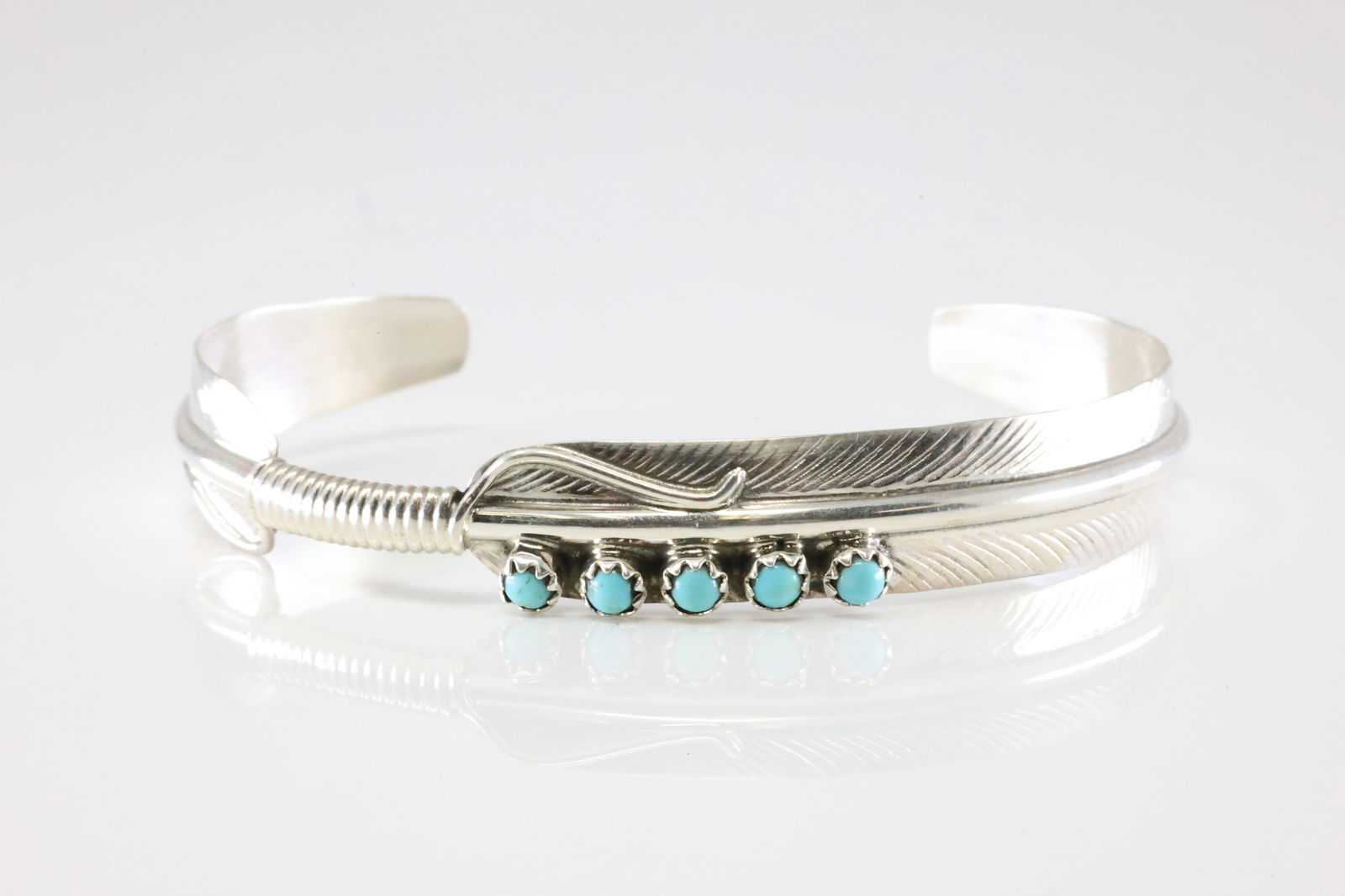 Native America Navajo Sterling Silver Turquoise Feather Bracelet Cuff By Aaron Davis.: This is a Native America Navajo Sterling Silver Turquoise Feather Bracelet Cuff By Aaron Davis. Stamp AD.