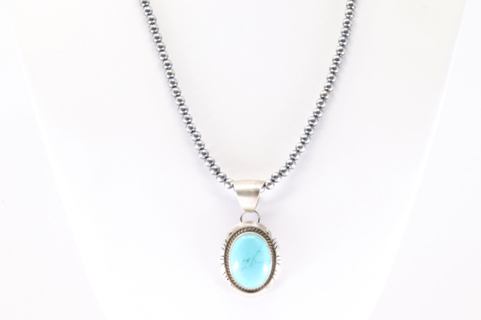 Native American Navajo Sterling Silver Kingman Turquoise Pendant By Alfred Martinez. With Pearl: This is a Native American Navajo Sterling Silver Kingman Turquoise Pendant By Alfred Martinez. With Pearl Beaded Sterling Silver Machine Made Necklace. Necklaec length: 18.00"