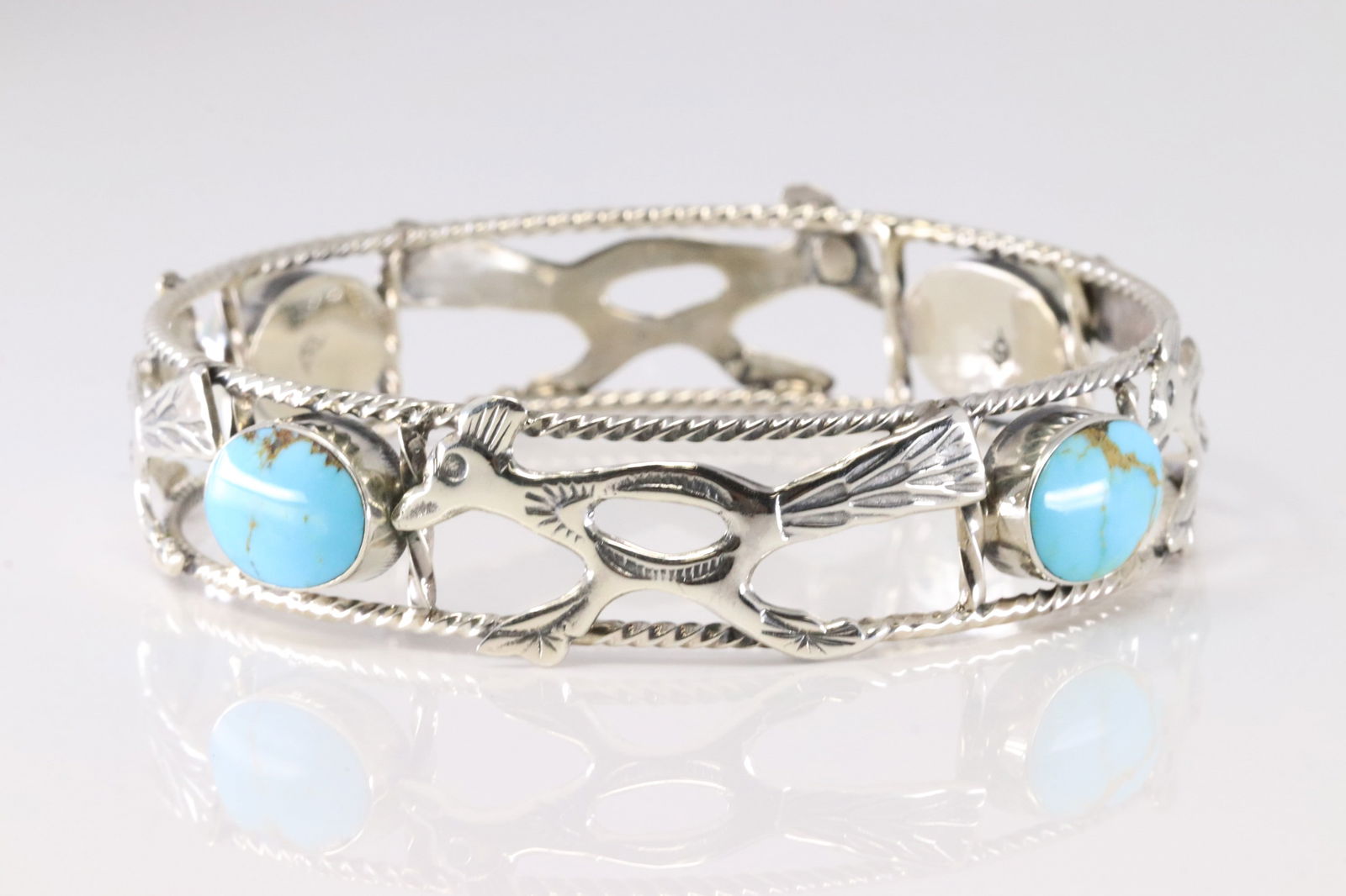 Native America Navajo Sterling Silver Turquoise Roadrunner Bangel Bracelet Cuff By David Lopez. From: This is a Native America Navajo Sterling Silver Turquoise Roadrunner Bangel Bracelet Cuff By David Lopez. From R.B Company. Stamp By R.B Company.
