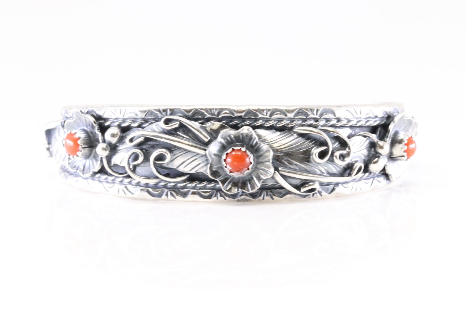 Native America Navajo Sterling Silver Coral Bracelet Floral Cuff By Bessie Joe.: This is a Native America Navajo Sterling Silver Coral Bracelet Floral Cuff By Bessie Joe.
