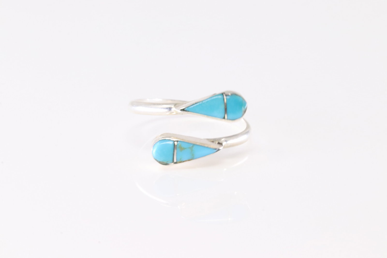 Native America Zuni Sterling Silver Turquoise Inlay Ring By RVN.: This is a Native America Zuni Sterling Silver Turquoise Inlay Ring By RVN. Stamp RVN. Ring Size: 7.00.