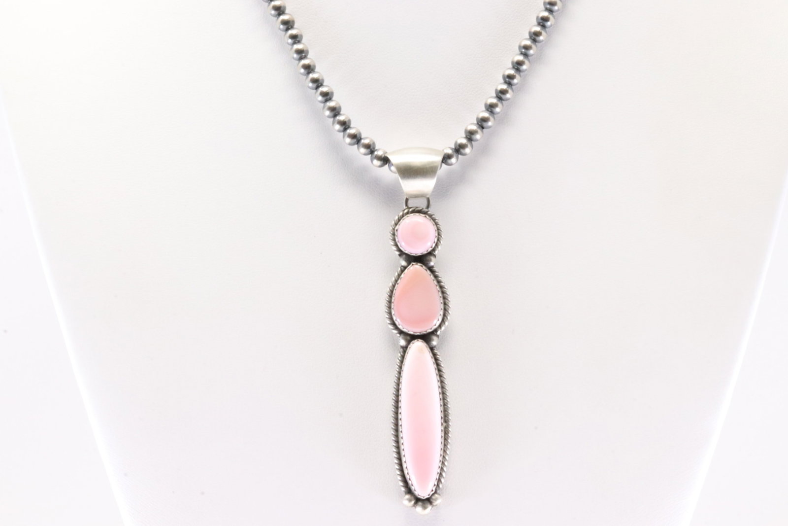 Native America Navajo Sterling Silver Pink Conch Shell Pendant By Freda Martinez. With Pearl Beaded: This is a Native America Navajo Sterling Silver Pink Conch Shell Pendant By Freda Martinez. With Pearl Beaded Sterling Silver Machine Made Necklace. Necklace length: 14.00"