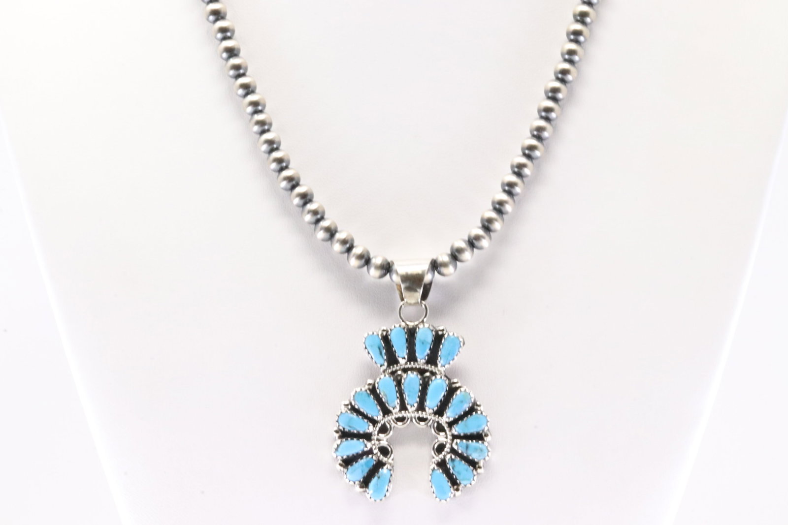 This is a Native America Navajo Sterling Silver Turquoise naja Pendant By Zeita Begay. With Pearl: This is a Native America Navajo Sterling Silver Turquoise naja Pendant By Zeita Begay. With Pearl Beaded Sterling Silver Machine Made Necklace. Necklace length: 16.00"