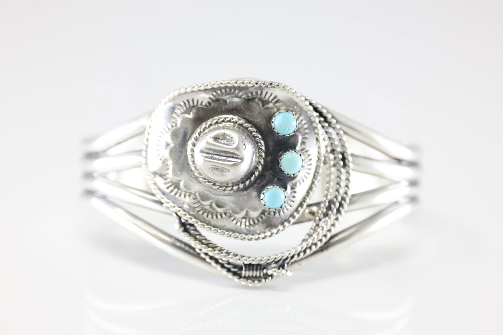 Native America Navajo Sterling Silver Turquoise Cowboy Hat Bracelet Cuff By Bobby Platero. From R.B: This is a Native America Navajo Sterling Silver Turquoise Cowboy Hat Bracelet Cuff By Bobby Platero. From R.B Company. Stamp By R.B Company.