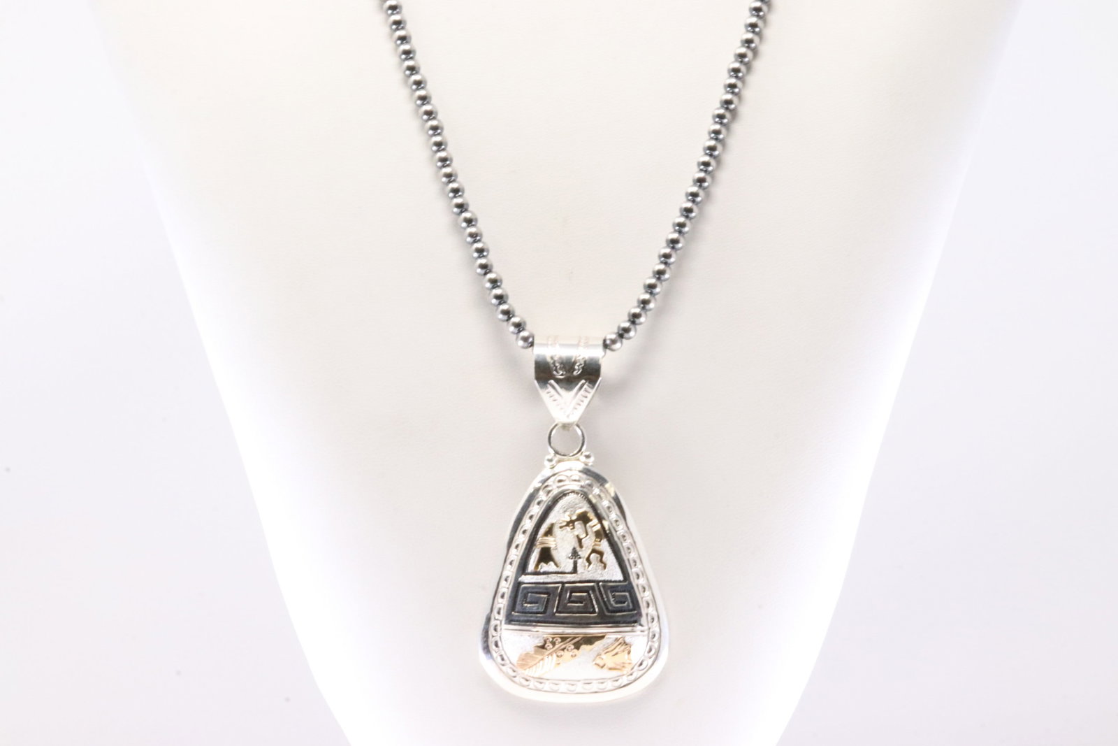 Native America Navajo Sterling Silver 12K Gold Filled / Kokopelli Design Pendant By Alonzo Mariano.: This is a Native America Navajo Sterling Silver 12K Gold Filled / Kokopelli Design Pendant By Alonzo Mariano. With Pearl Beaded Sterling Silver Machine Made Necklace. Necklace length: 24.00"