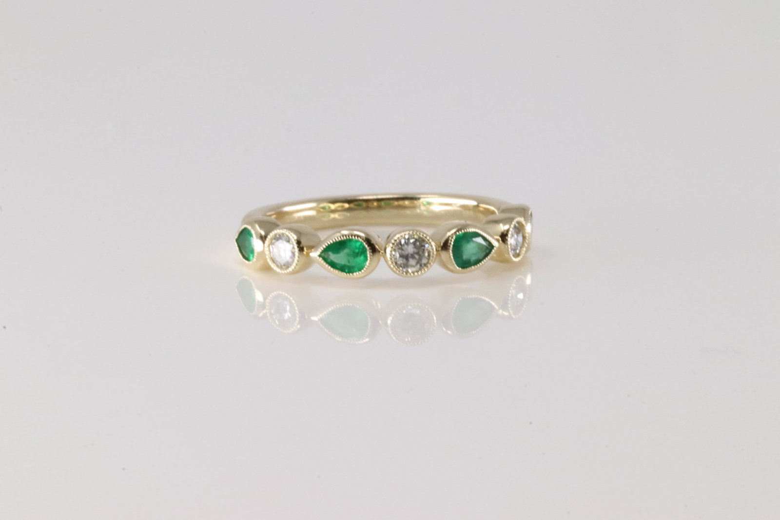 Emerald & Diamond Ring 14Kt.: Ladies 14Kt Yellow Gold Emerald & Diamond Ring. This Charming Ring has 4 Green Pear-Shape Eemralds with 3 Round Diamonds. Diamodns weight: 0.25ctw. Emeralds weight: 0.46ctw. Ring size: 6.50. Total