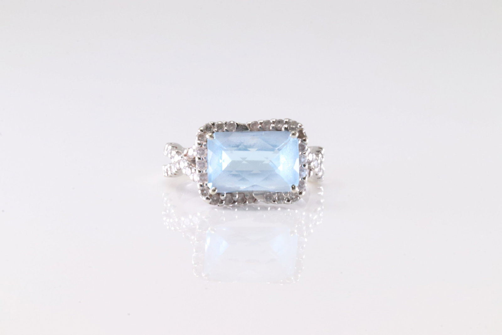 Aquamarine & Diamond Ring 14Kt.: Ladies 14Kt White Gold Aquamarine & Diamond Ring. This Charming Ring has A Squared Aquamarine Gemstone With 60 Round Sparkling Diamonds. Diamond Weight Approx: 0.65 ctw Ring Size: 7.75. Total Weight:
