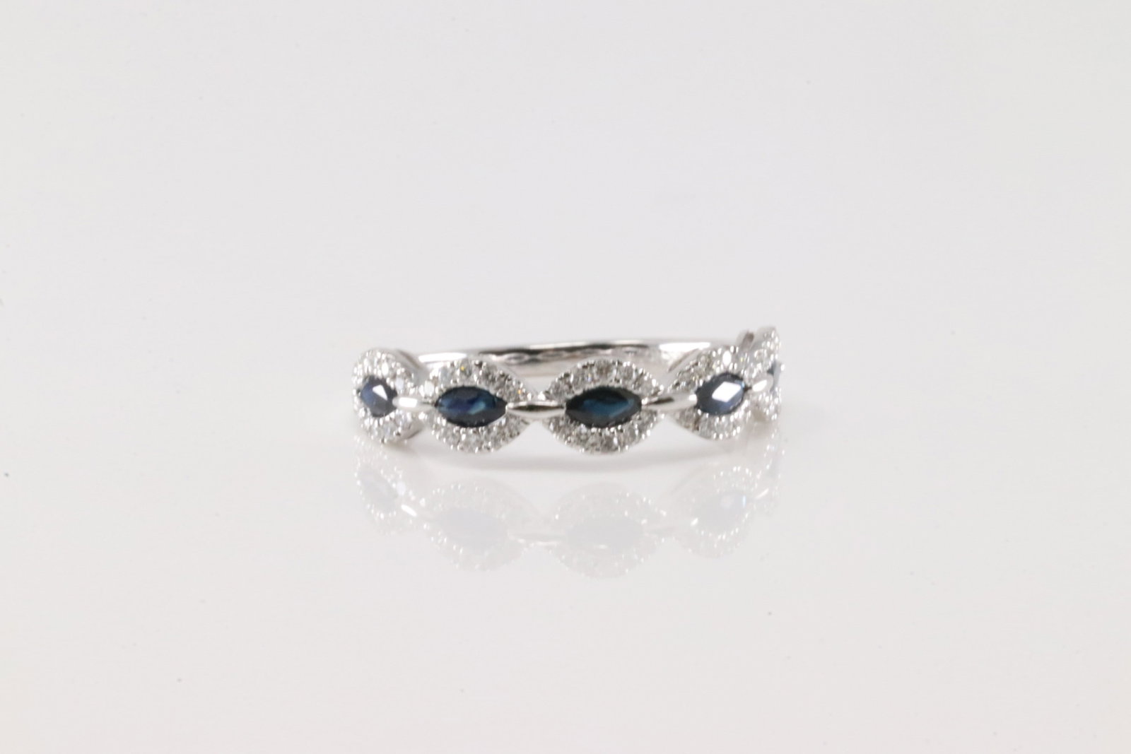 Sapphire & Diamond Ring 14Kt.: Ladies 14Kt White Gold Sapphire & Diamond Ring. This Elegant Ring has 5 Blue Sapphires with 54 round Diamonds. Diamonds weight: 0.27ctw. Sapphires weight: 0.58ctw. Ring size: 6.50. Total weight: 2.30