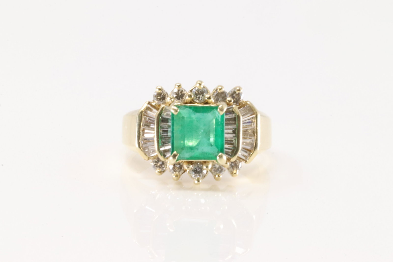 Elegant Emerald & Diamond Ring 14Kt.: Ladies 14Kt Yellow Gold Elegant Emerald & Diamond Ring. This Elegant Ring has Square Cut Emerald with diamond accent Baguette & Round Diamonds. Diamonds weight approx: 1.00cttw. Ring size: 5.50.