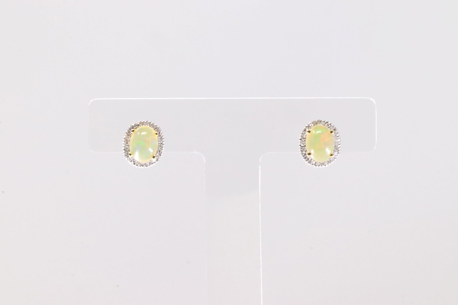 Citrine & Diamond Stud Earring 14Kt.: Ladies 14Kt Yellow Gold Citrine & Diamond Stud Earring. This Elegant Earring's has Oval Citrine Gemstone With 48 Round Sparkling Daimonds. Total Weight: 2.29 Grams.
