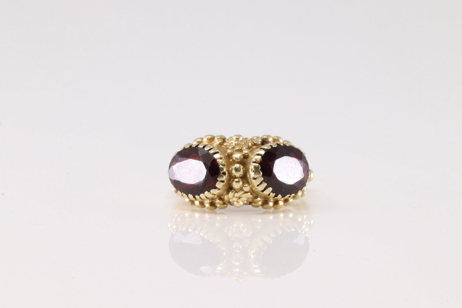 Elegant Garnet Ring 14Kt.: Ladies 14Kt Yellow Gold Garnet Ring. This Elegant Ring has Two Garnet Gemstone. Ring size: 6.50. Total weight: 5.30 Grams.