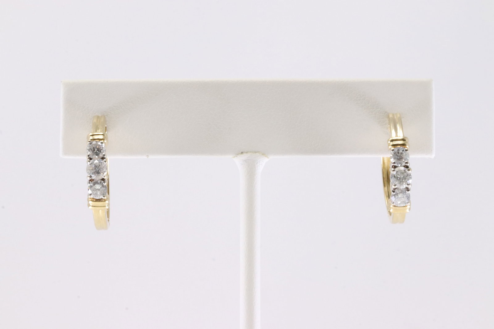 Diamond Hoop Earring 14Kt.: Ladies 14Kt Yellow Gold Diamond Hoop Earring. This Charming Hoop Earring's has 3 Brilliants Diamonds on Each. Total weight: 4.80 Grams.