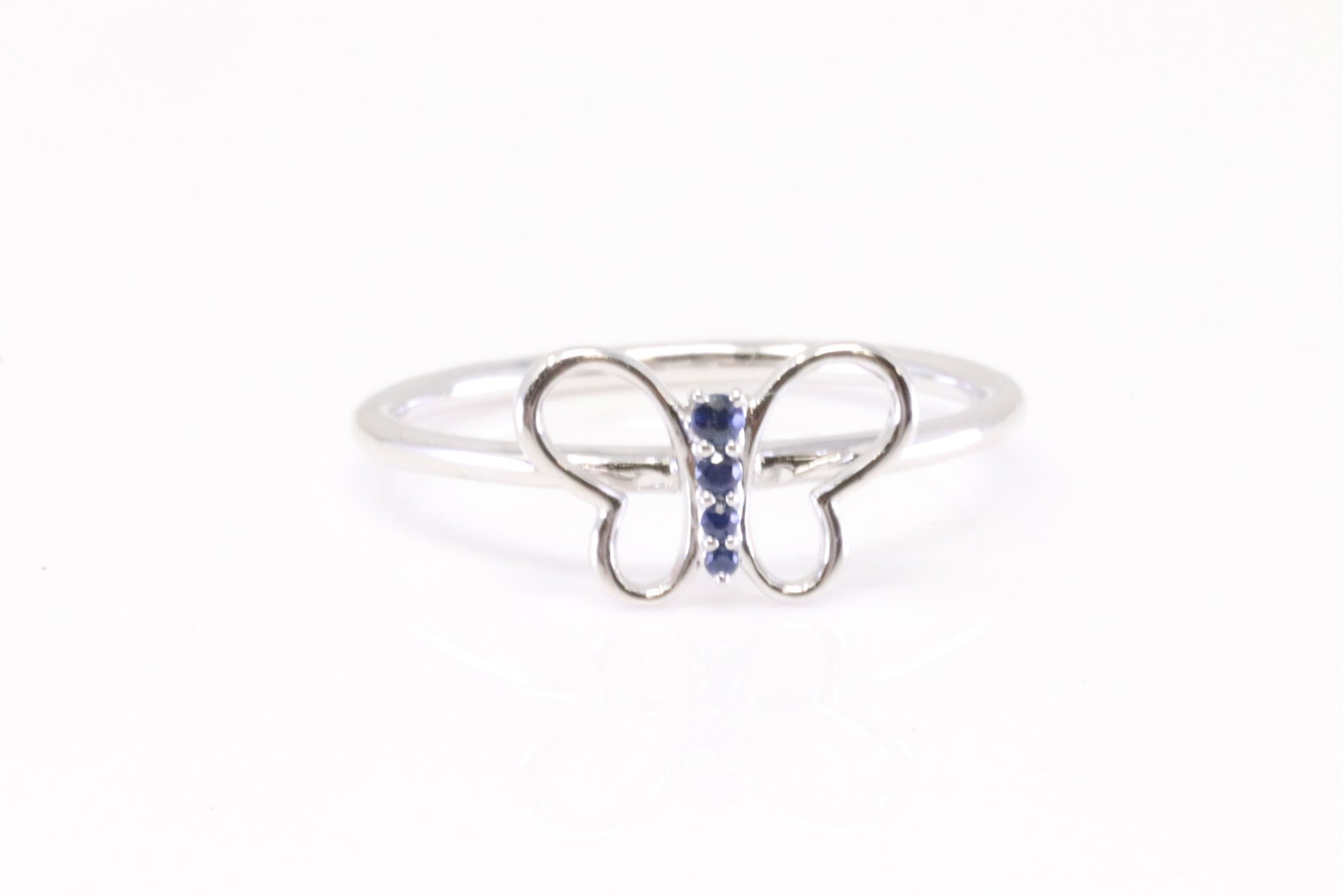 Sapphire Butterfly Ring 10Kt.: Ladies 10Kt White Gold Sapphire Butterfly Ring. Ring has 4 rund Sapphire's. Ring size: 7.00.