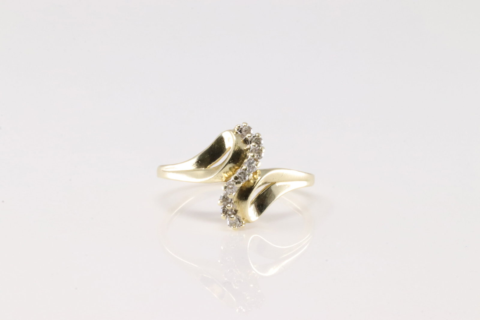 Diamond Ring 10Kt.: Ladies 10Kt Yellow Gold Diamond Ring. This Charming Ring has 9 Sparkling Diamonds. Diamonds weight approx: 0.20ctw. Ring size: 7.00.