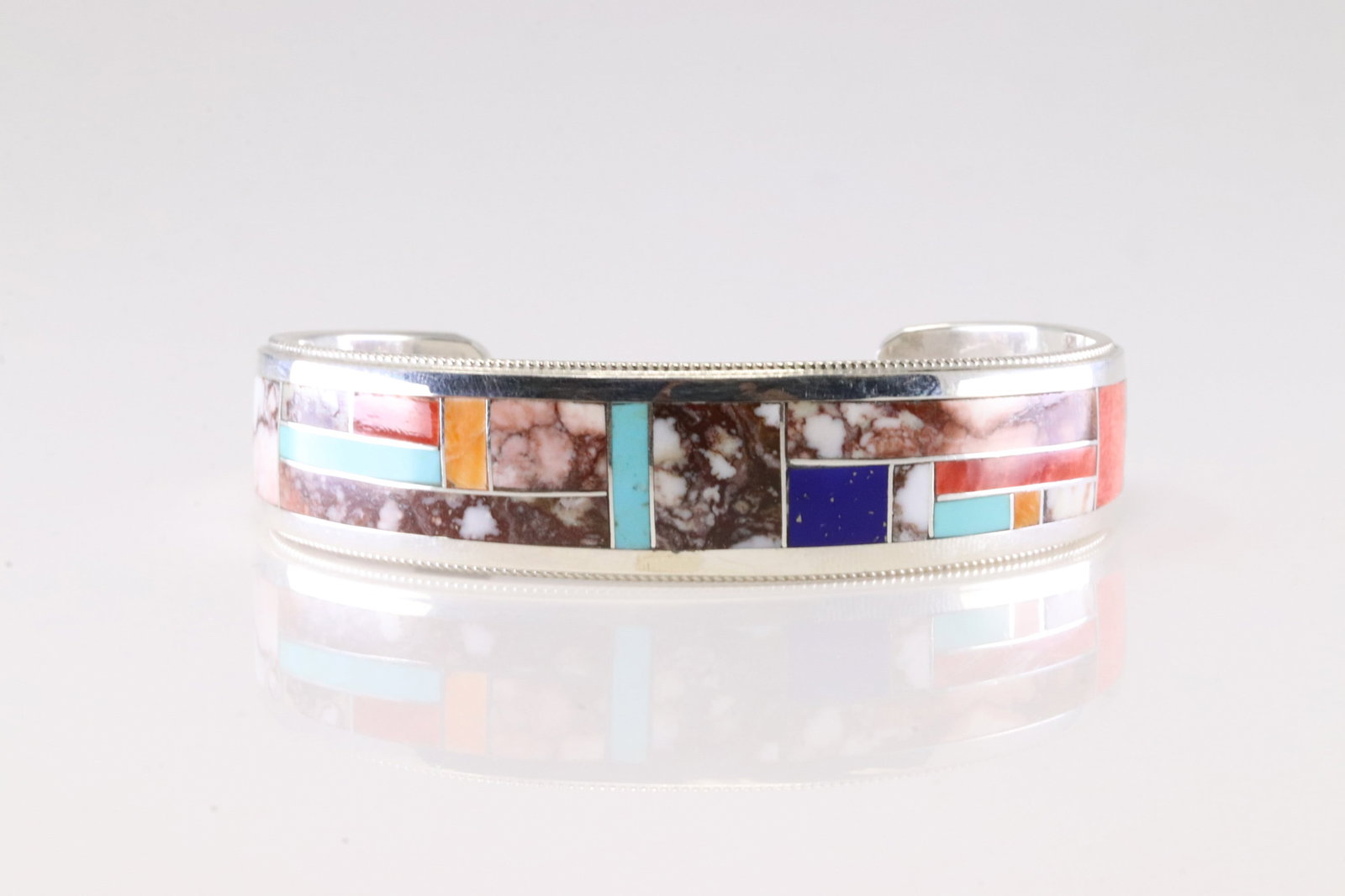 Native America Zuni Sterling Silver Multi-Color Stone Inlay Bracelet Cuff By R.G.B.: This is a Native America Zuni Sterling Silver Multi-Color Stone Inlay Bracelet Cuff By R.G.B.