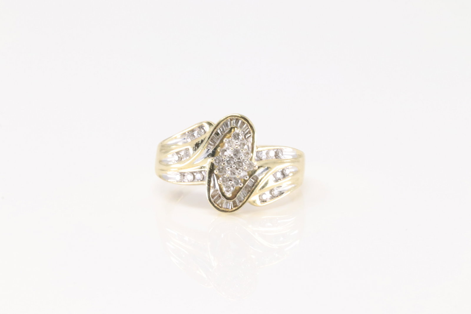 Diamond Ring 10Kt.: Ladies 10 Kt Yellow Gold Diamond Ring. This Elegant Ring has A Total Of 50 Baguette & Round Brilliant Diamonds. Ring Size: 9.50. Total Weight: 4.20 Grams.