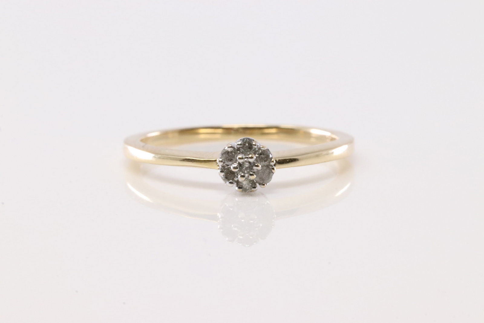 Diamond Ring 14K.: Ladies 14Kt Yellow Gold Diamond Ring. This Elegant Ring has 7 Round Sparkling Diamonds. Diamond Approx Weight: 0.25ctw. Ring Size: 6.75.